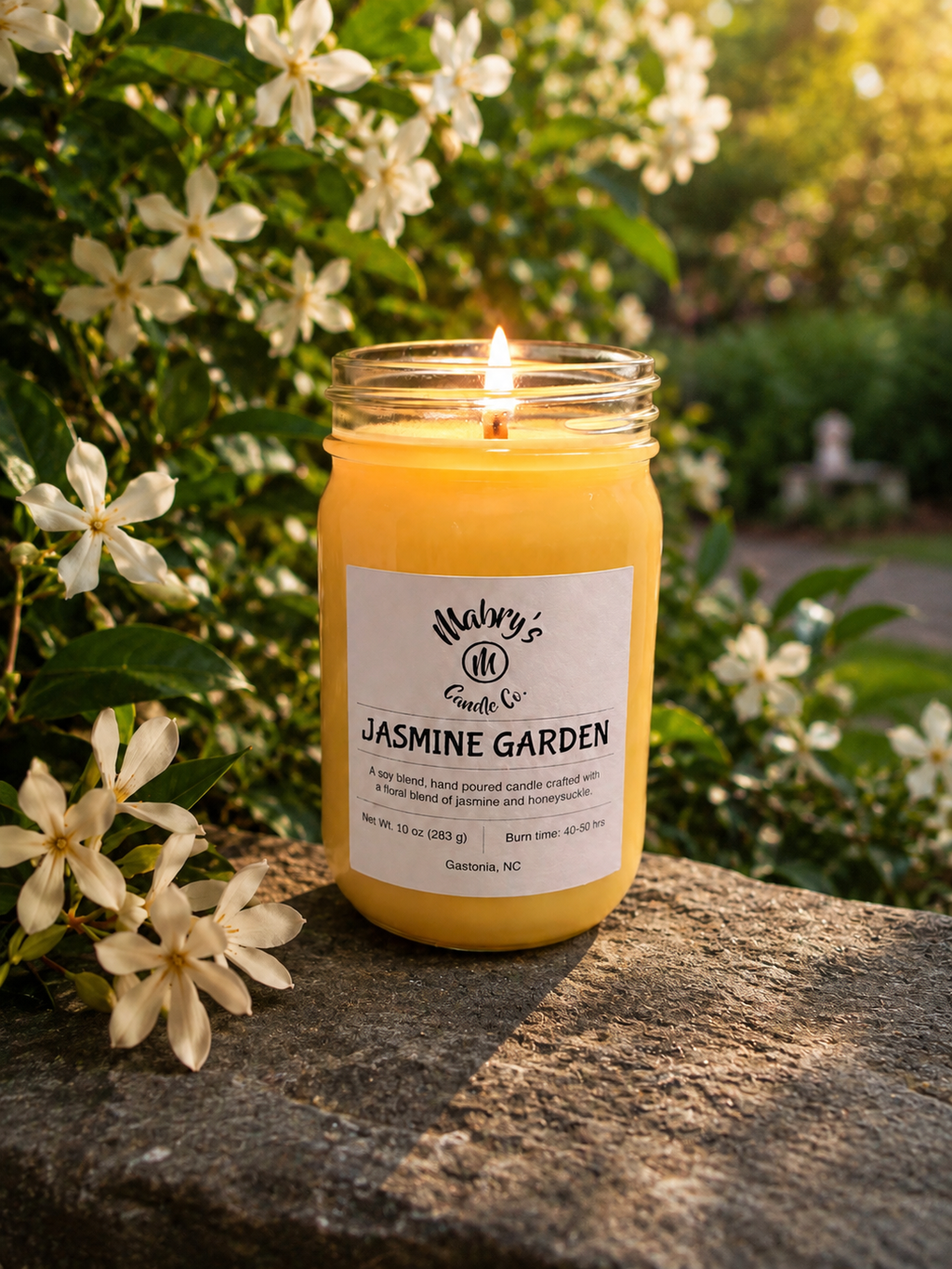 Product photo of a 12 oz canning jar candle in Jasmine Garden scent