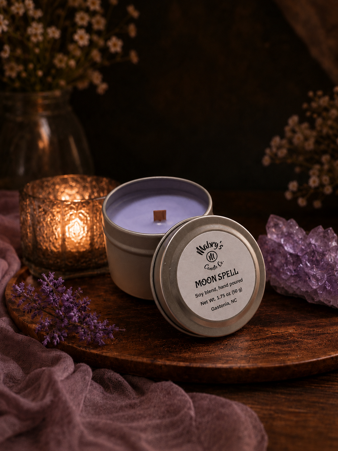 Product photo of a 2 oz candle tin in Moon Spell scent
