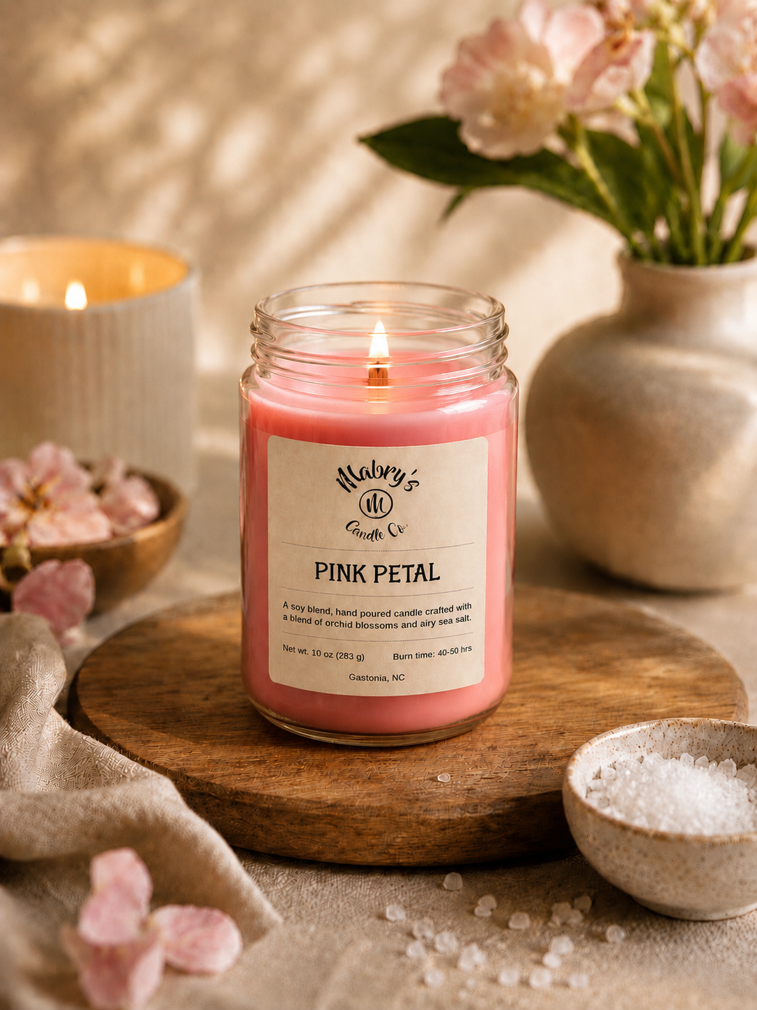 Product photo of a 12 oz canning jar candle in Pink Petal scent