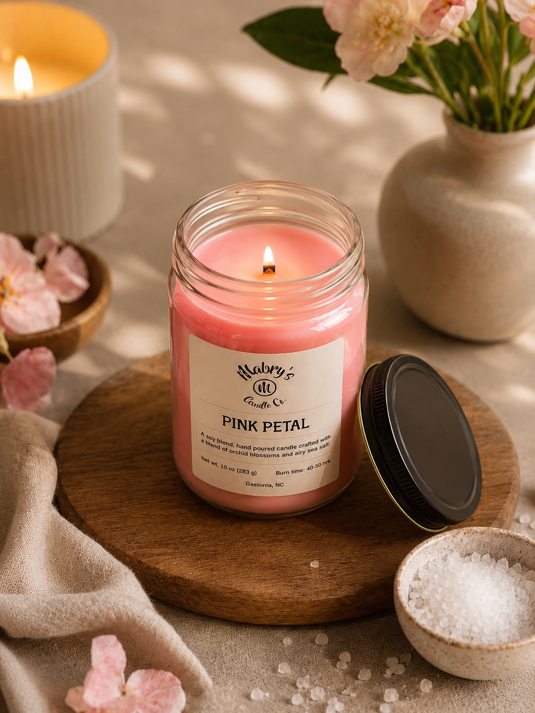 Product photo of a 12 oz canning jar candle in Pink Petal scent