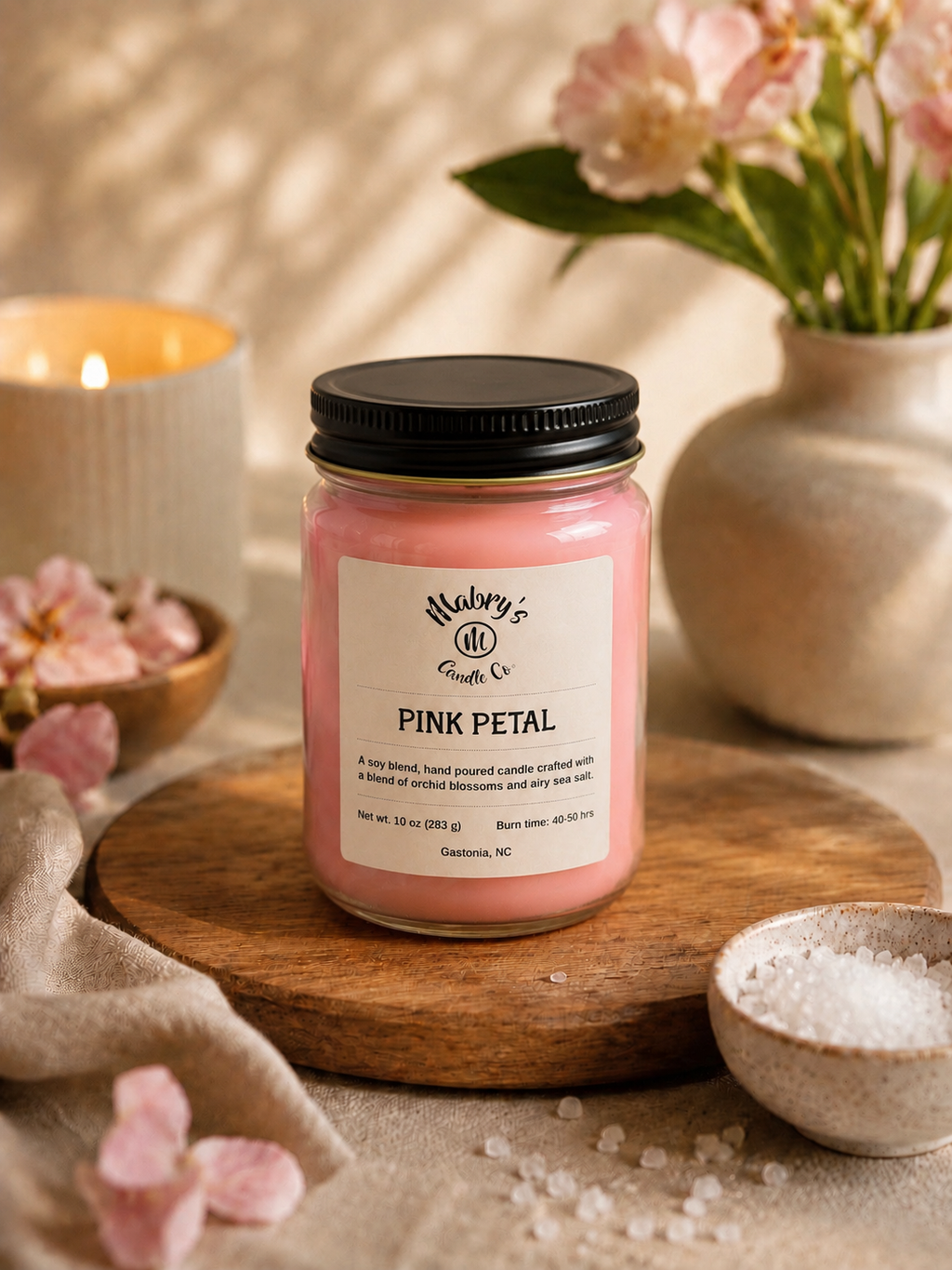 Product photo of a 12 oz canning jar candle in Pink Petal scent